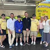 Youngsted's Excelsior, Minnesota employees with Carolyn Manhatton of Excelsior Paint and Design Carpet One during a celebration event.